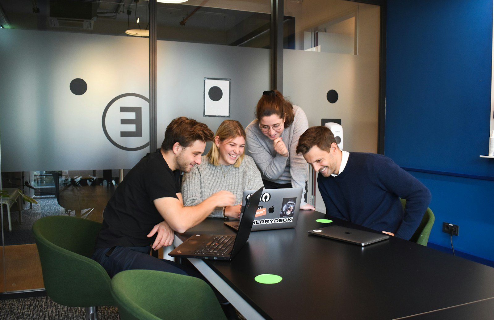 people sitting on chair in front of laptop computers